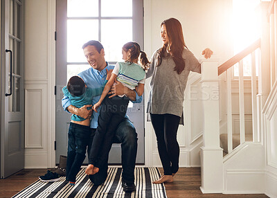 Buy stock photo Hello, door and parents with children hug in home for greeting, welcome and bonding. Family, happy and mother, father and kids in house embrace for affection, relationship and excited for return