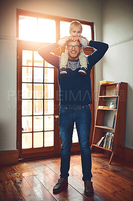 Buy stock photo Father, happy and baby on shoulders for portrait, love and support in living room. Dad, smile and lifting kid at home for play, bonding and child growth or development on fathers day in Canada