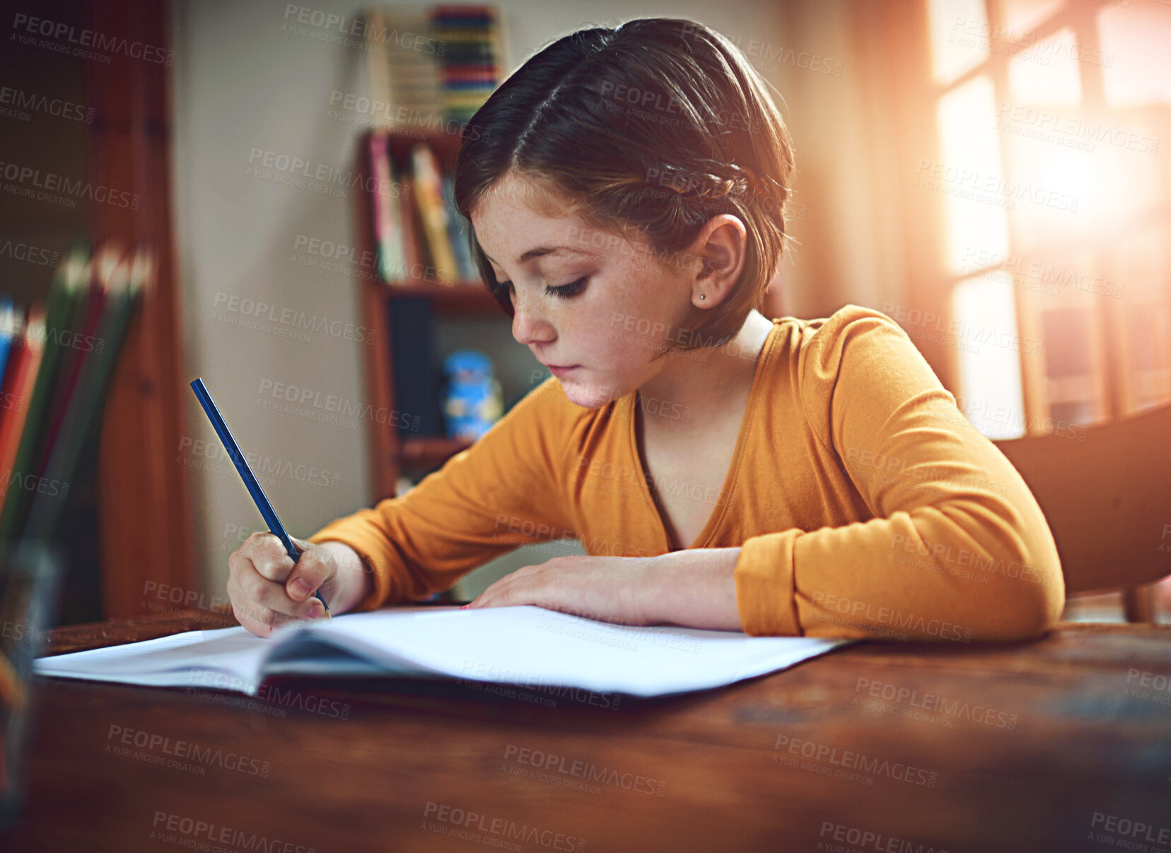 Buy stock photo Education, notebook and writing with student girl in dining room of home for distance learning. Child development, growth and study with kid at desk in bedroom of apartment for academic scholarship