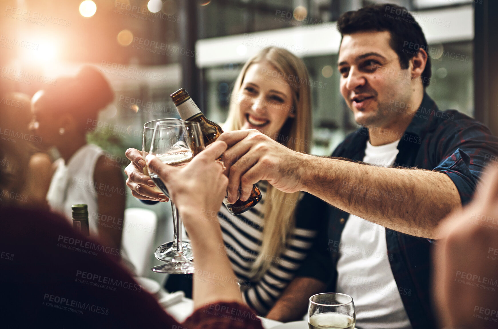 Buy stock photo Alcohol, glass and toast with friends at party together for new year celebration, event or social gathering. Cheers, crowd and smile with group of happy young people at venue for bonding or drinking