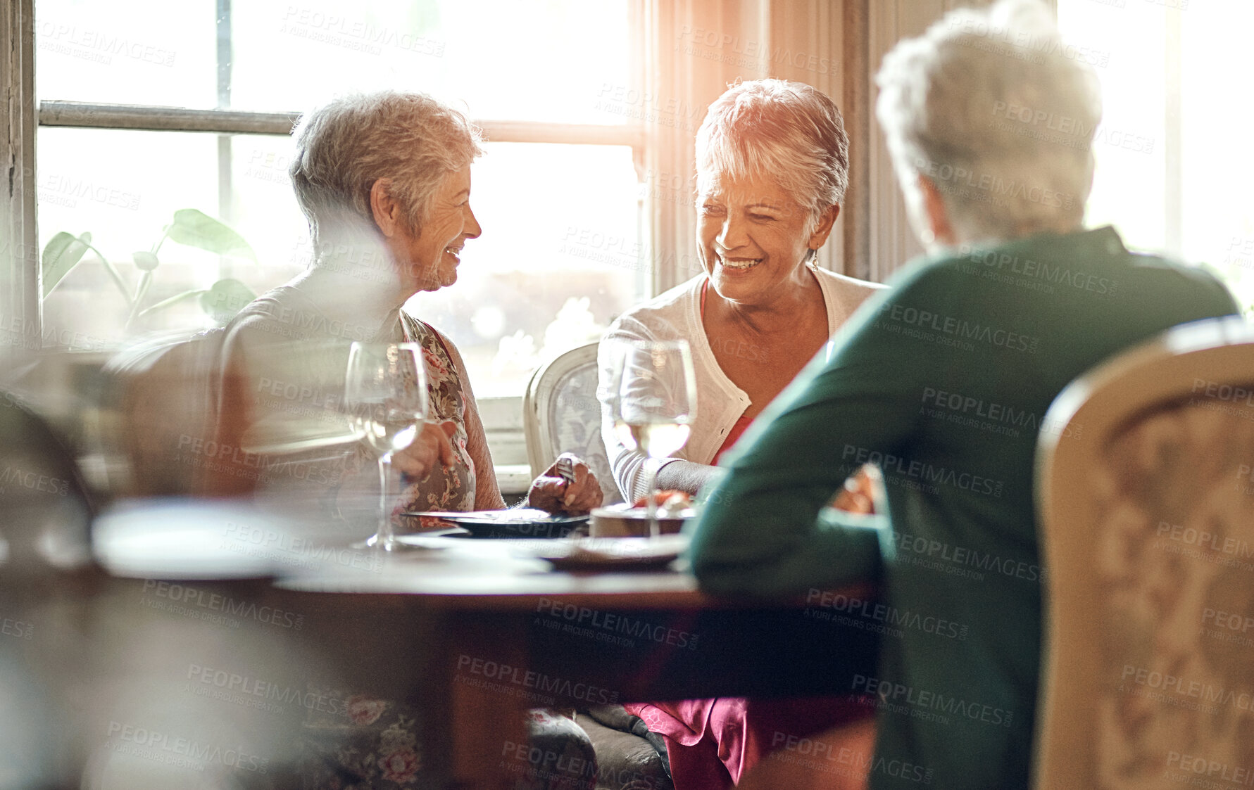 Buy stock photo Senior women, friends and smile in restaurant for wine, vacation and retirement together with happy. Elderly people, reunion and relax in diner for drinks, holiday and social celebration with memory