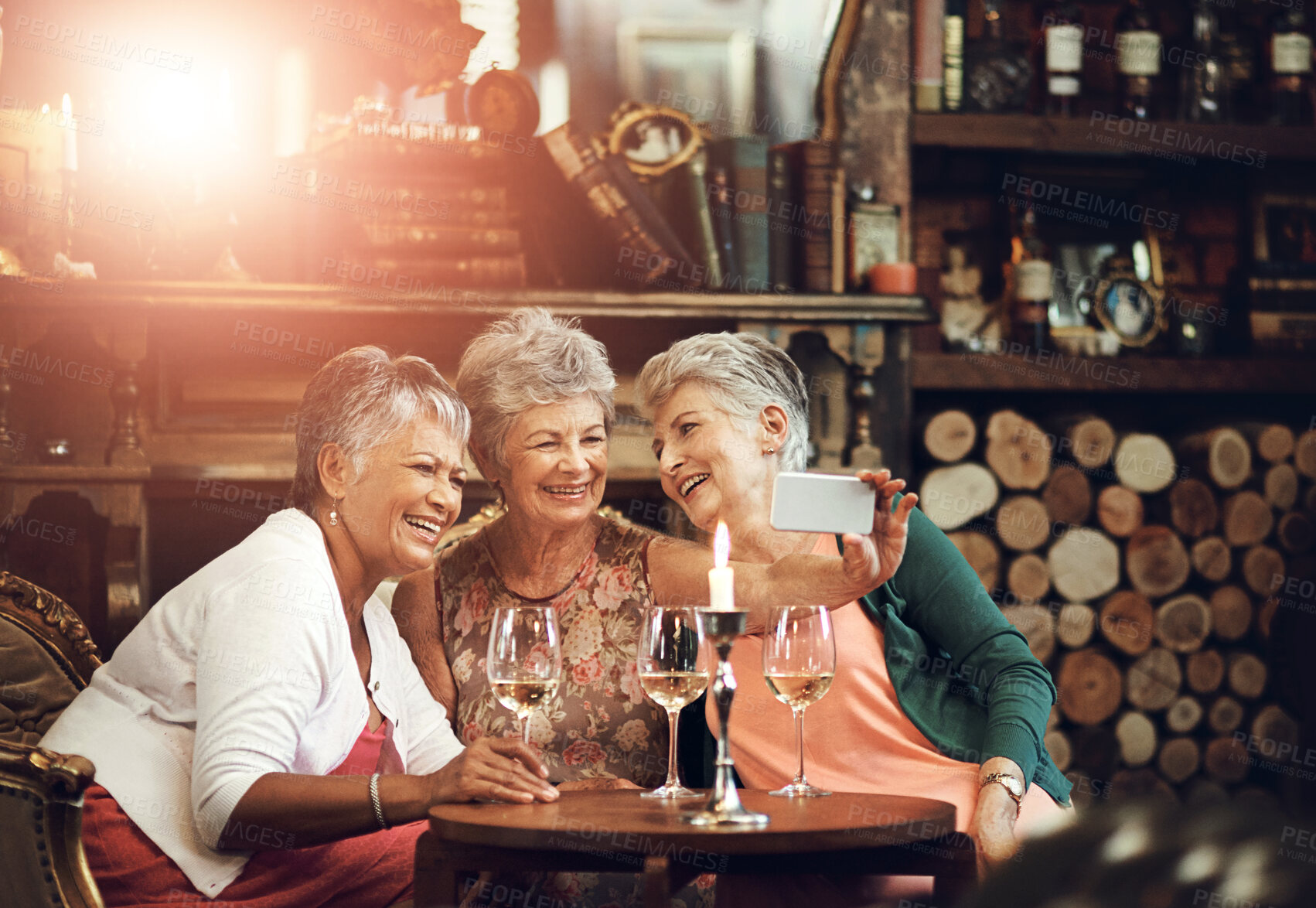 Buy stock photo Senior women, friends and selfie in restaurant for wine, vacation and retirement together with happiness. Elderly people, reunion and memory in diner for drinks, holiday and birthday celebration