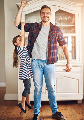 Buy stock photo Father, girl child or hanging on arm in home, happy development or motor skills with growth. Superhero dad, kid or portrait in house for bonding, energy flex with muscle and young kid in apartment