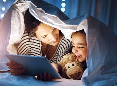 Buy stock photo Bedtime, reading on tablet with mother and daughter in blanket together for bonding at night. Love, smile or storytelling and woman single parent with happy girl child in bedroom of home for fantasy