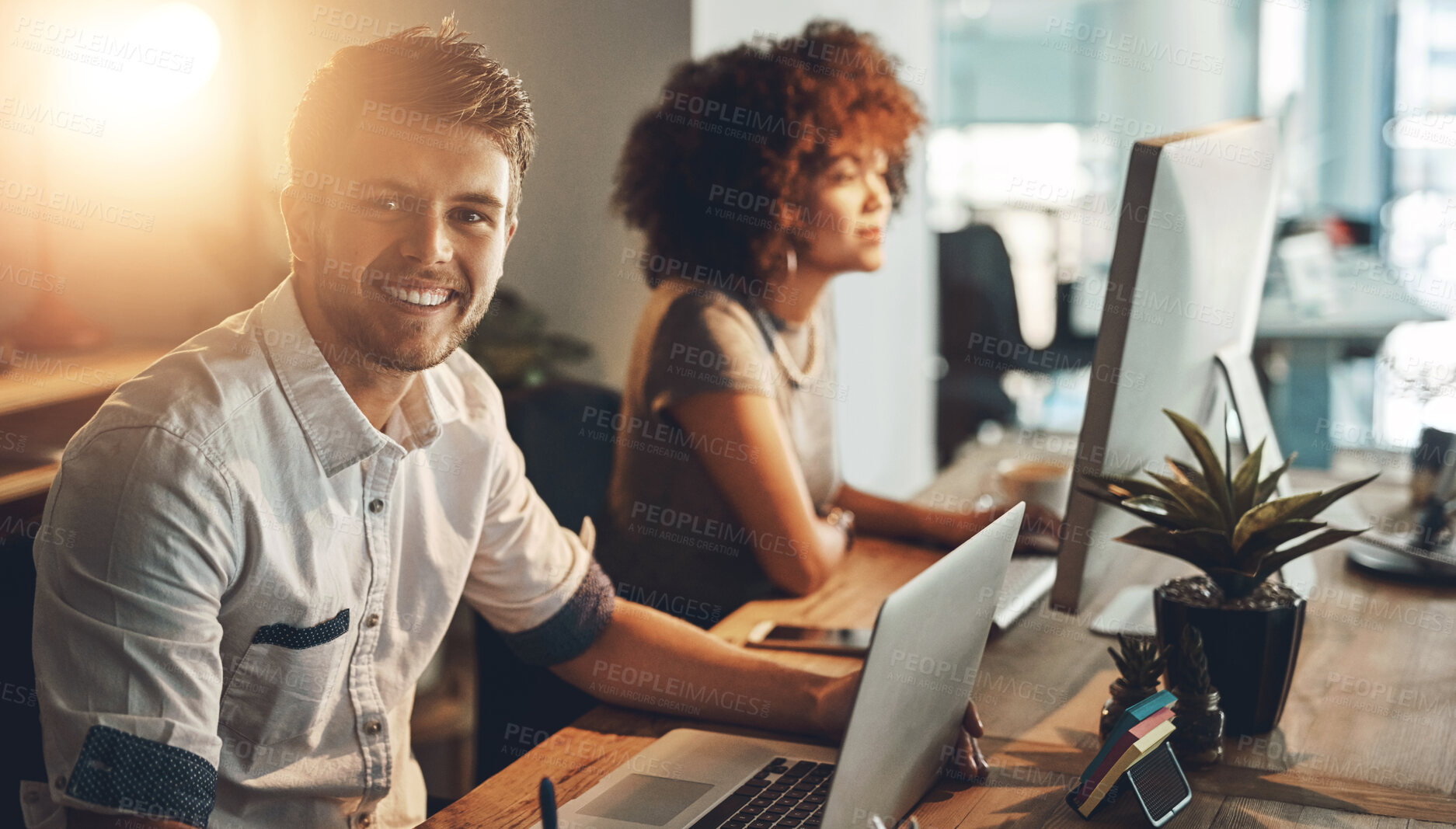 Buy stock photo Portrait, man and team in office at night for social media management, deadline and success. Technology, collaboration and male creator at desk with partner, happiness and positive review on internet