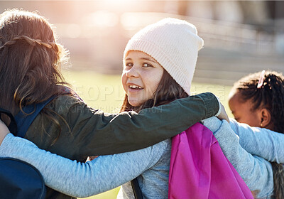 Buy stock photo Back, portrait and smile of girl with friends outdoor on playground together for bonding or hugging. Education, face and love with happy child student at school for development, learning or study