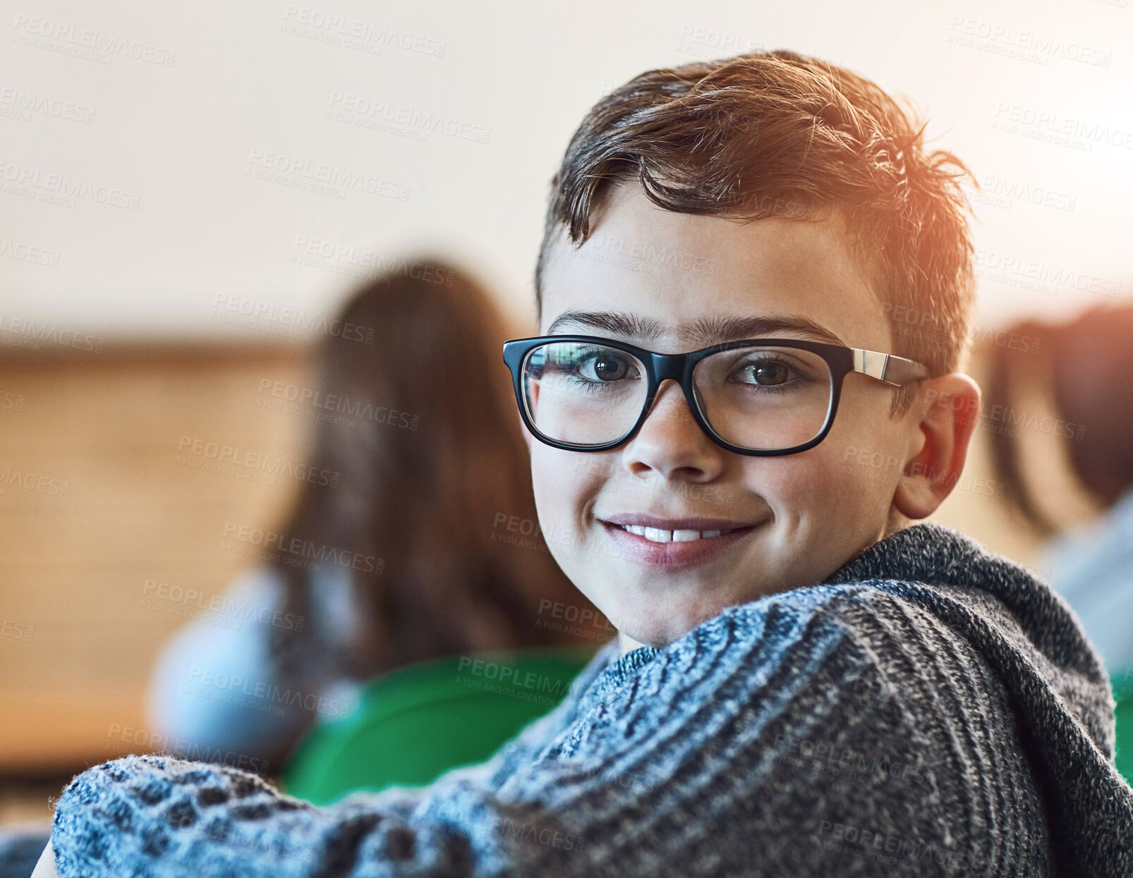 Buy stock photo Boy, class and portrait of face with glasses for education, learning and development in junior school. Male learner, smile and knowledge in classroom for subject, growth and happiness for information