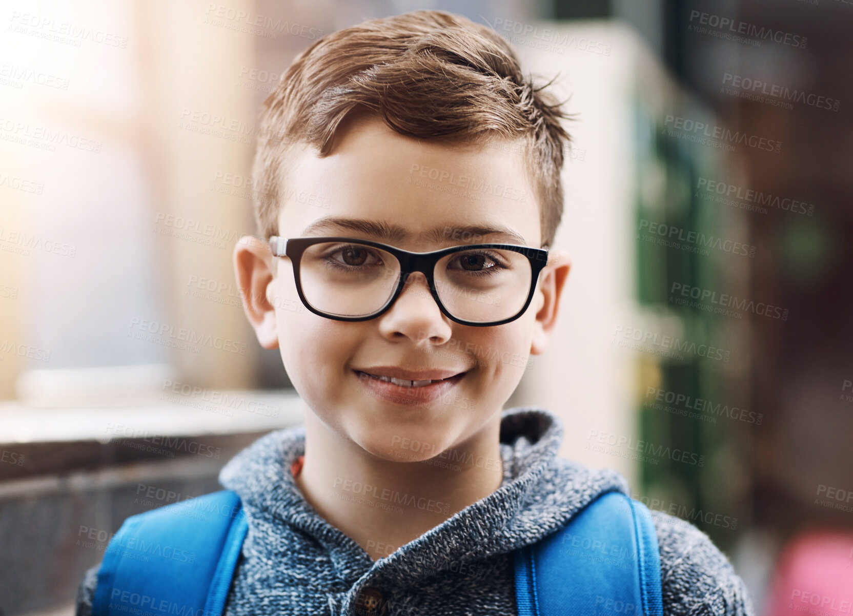 Buy stock photo Smile, portrait and child with glasses at school for education with eye care, optical health and wellness. Happy, backpack and face of boy kid with prescription spectacles for vision at academy.