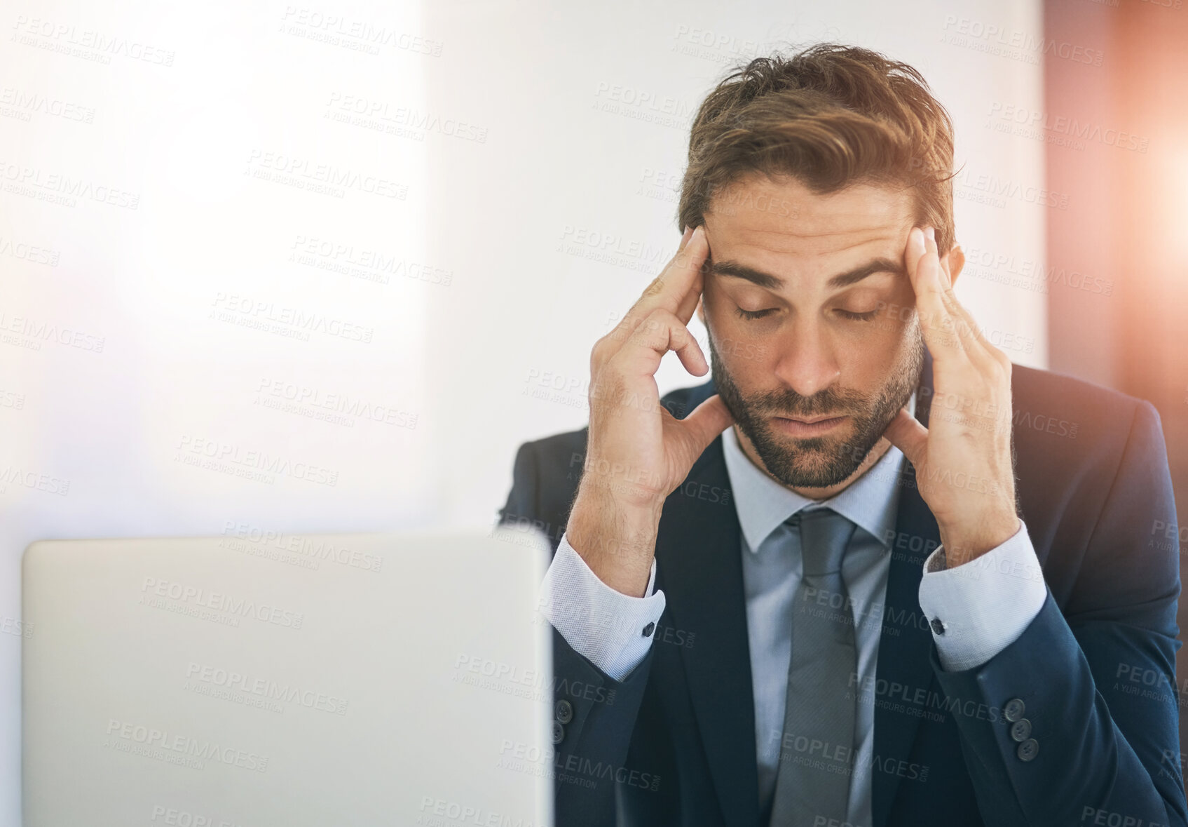 Buy stock photo Man, laptop or screen in office with headache for digital job, mental health or pain at desk. Male designer, workplace or computer with hands for stress, website development or creative tension