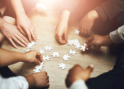 Buy stock photo Hands, puzzle and group in circle with strategy, problem solving and connection for synergy with people. Teamwork, link and solution in scrum, huddle or above for collaboration, community and jigsaw