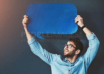 Buy stock photo Businessman, face and communication with speech bubble on studio background for FAQ or company announcement. Mockup space, cardboard sign or person with poster for opinion, positive feedback or quote