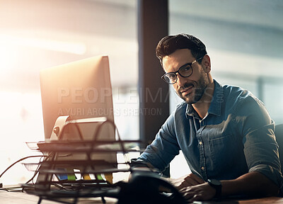 Buy stock photo Working man, computer and portrait in office for business, happy for overtime at corporate company. Male person, desktop and tech with glasses for vision with design, planning for website development