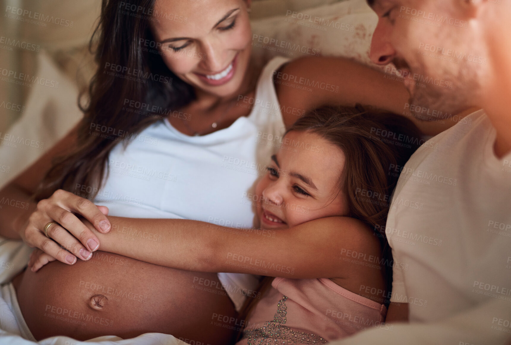 Buy stock photo Child, happy family and pregnancy on bed with hug, support and daughter in morning. Parents, girl and love in bedroom for growth, safety and security at home with happiness, smile and excitement