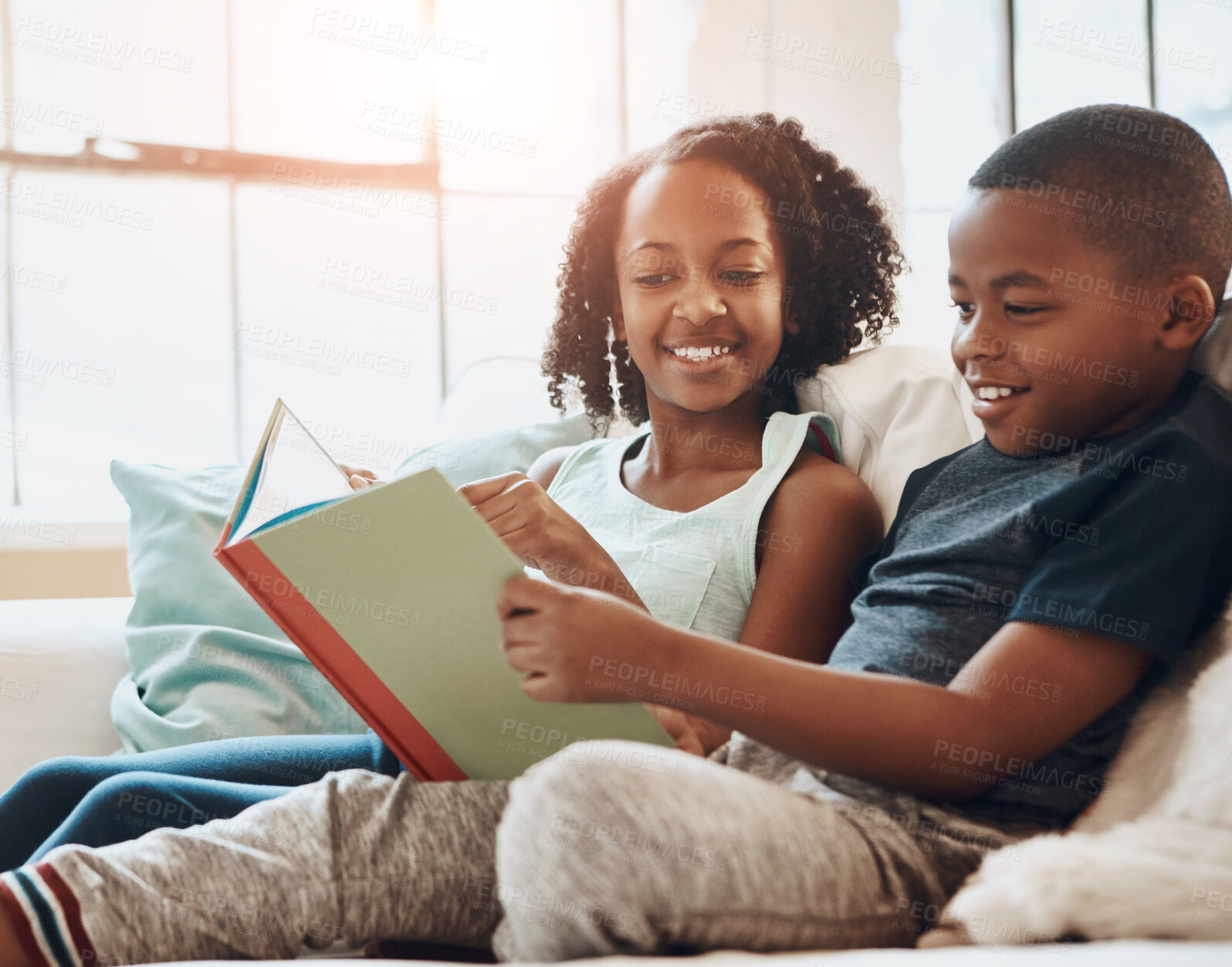 Buy stock photo Boy, sister and reading book on sofa house for knowledge, bonding and learning literature, fantasy and language development. Family, girl and storytelling, education and information of child growth