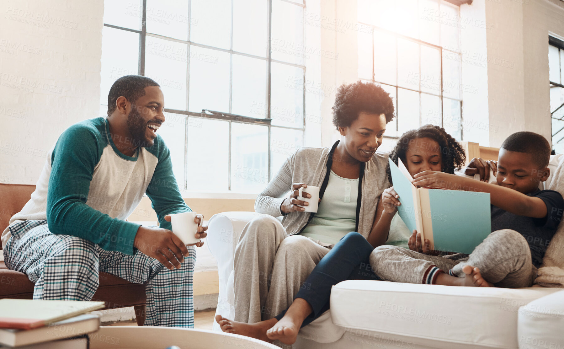 Buy stock photo Reading, relax and black family with book on sofa for bonding together on fathers day at home. Smile, knowledge and African parents resting with children in living room with fantasy story or novel.