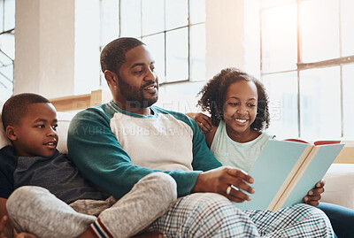 Buy stock photo Reading, book and children with dad on sofa for bonding together on fathers day at home. Happy, knowledge and black family relaxing in living room with fantasy story or novel for language development