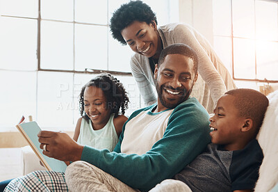 Buy stock photo Reading, happy and black family with book on sofa for bonding together on fathers day at home. Smile, knowledge and African parents relaxing with children in living room with fantasy story or novel.