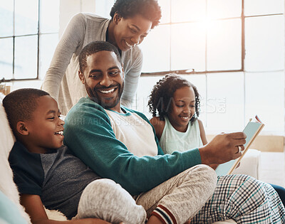 Buy stock photo Black family, book and children with reading on sofa with smile, care and learning for language in home. African parents, people and storytelling for connection, bonding and relax in pajamas on couch