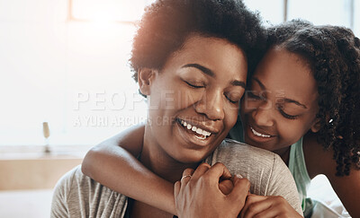 Buy stock photo Love, mother and daughter with hug in living room for bonding, connection or relax together. Smile, single parent and black woman with young child for embrace, happiness or care in family home