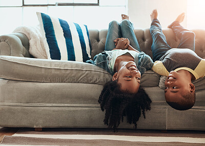 Buy stock photo Upside down, relax and kids on couch, happiness and playing indoors for imagination, weekend break and siblings bonding together in living room. Children, home and boy with girl, fun and cheerful