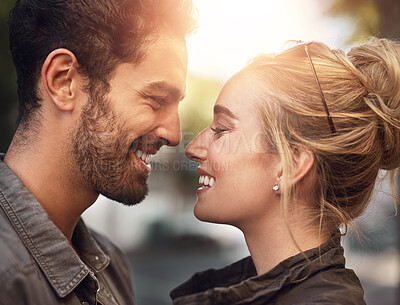 Buy stock photo Couple, eye contact and happy in profile, outdoor and bonding with love, care and connection in city. People, man and woman with smile for holiday, summer and together on metro sidewalk in Berlin