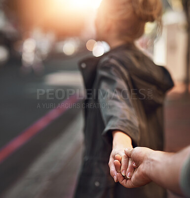 Buy stock photo Love, pov and couple holding hands in city for trip, bonding and connection on outdoor date. Follow, man and woman together in town on vacation, holiday and travel on journey for tourism in France