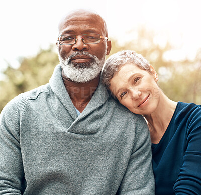 Buy stock photo Mature couple, portrait and relax outdoor for retirement, holiday and bonding with sunshine or flare. Interracial marriage, face and people in nature for summer, vacation and love together with hug