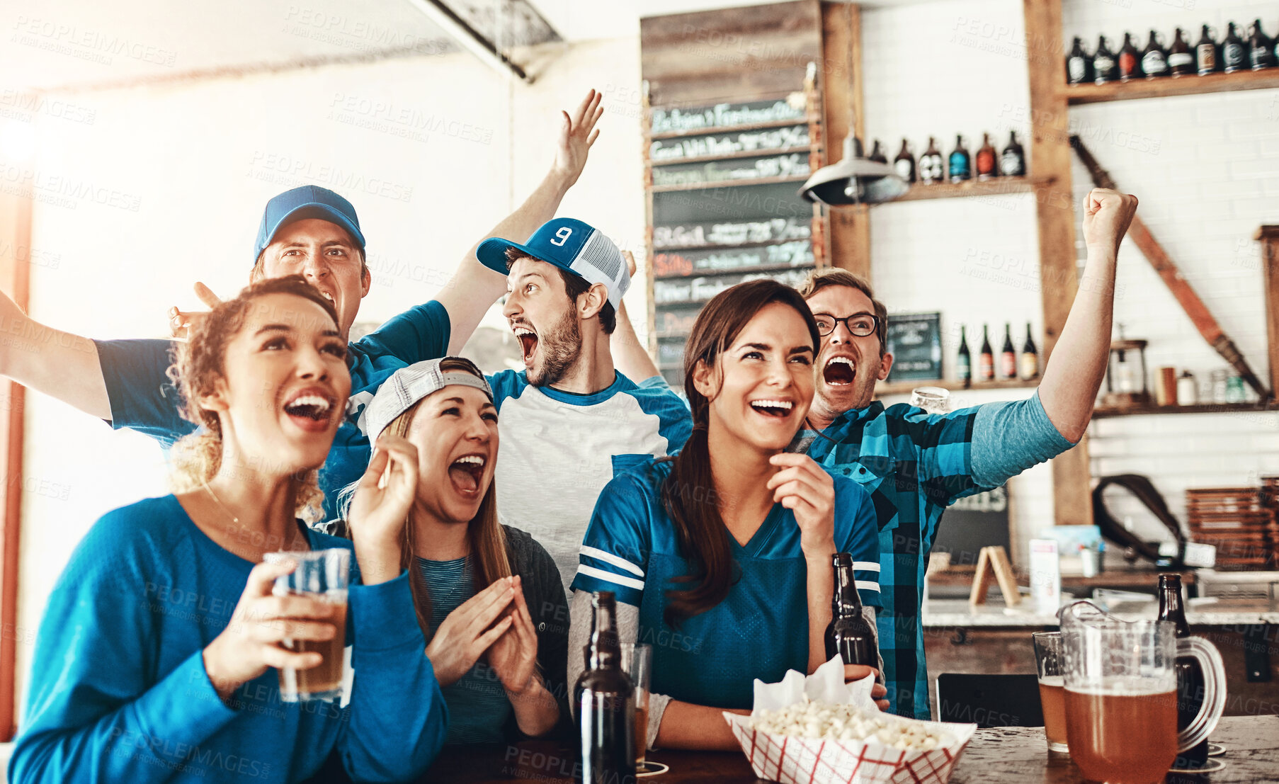 Buy stock photo Beer, sports and excited fans in pub for winning game with goal for celebration in support together. Group, cheering and friends drink alcohol and watch broadcast television of team match in bar.