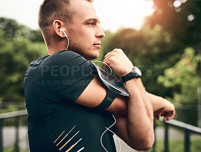 Buy stock photo Outdoor, stretching and man with fitness, nature and energy for warm up, challenge and training. Person in park, podcast or runner with exercise, listening to music and workout with wellness or radio