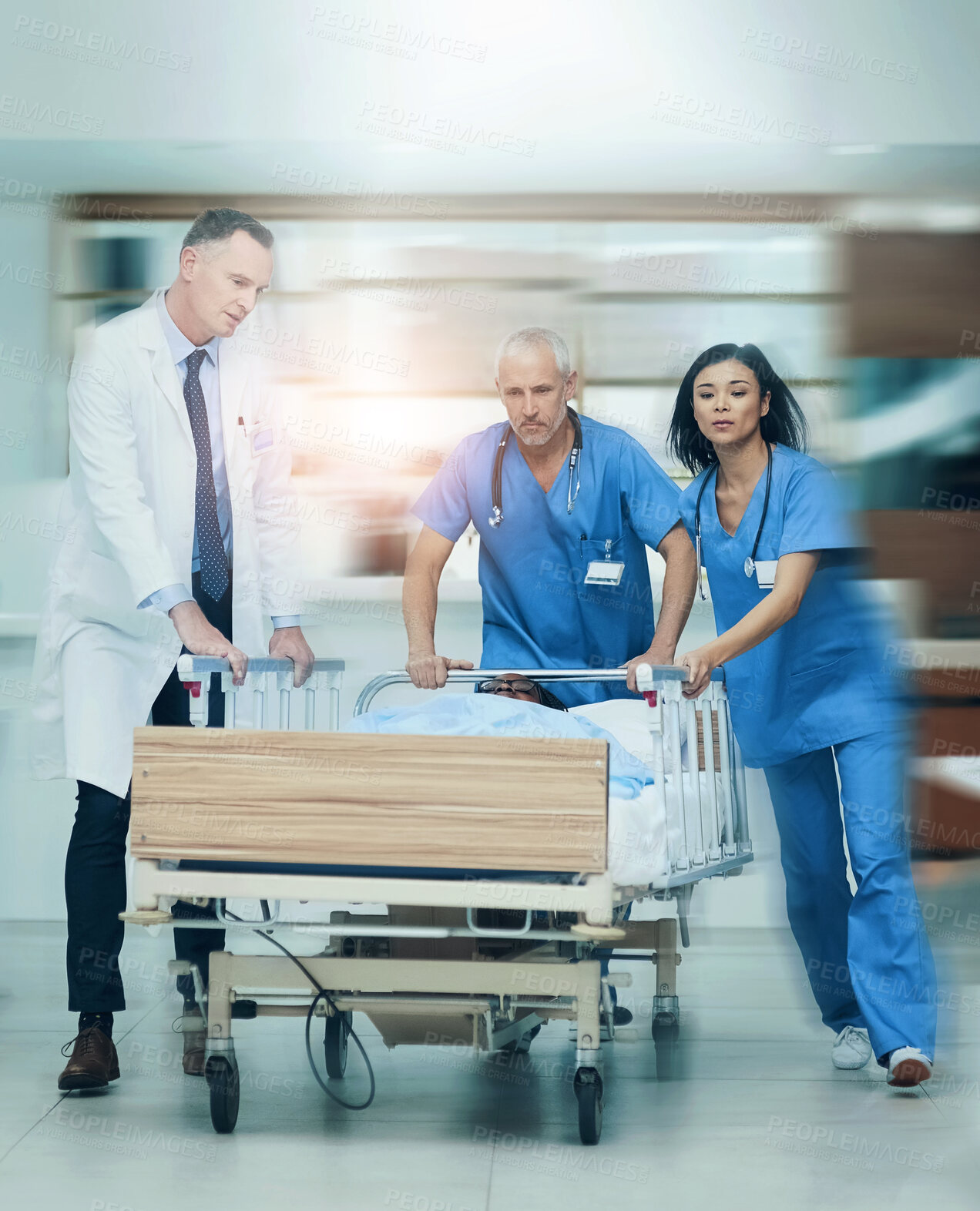 Buy stock photo People, hospital and emergency with patient in bed, care for crisis with health insurance. Teamwork, diversity and medical problem in clinic with speed, doctors with collaboration for saving life