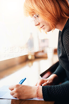 Buy stock photo Book, notes and woman writing in coffee shop studying for university exam, test or assignment. Pen, reading and female student filling in document for college scholarship for education in cafe.