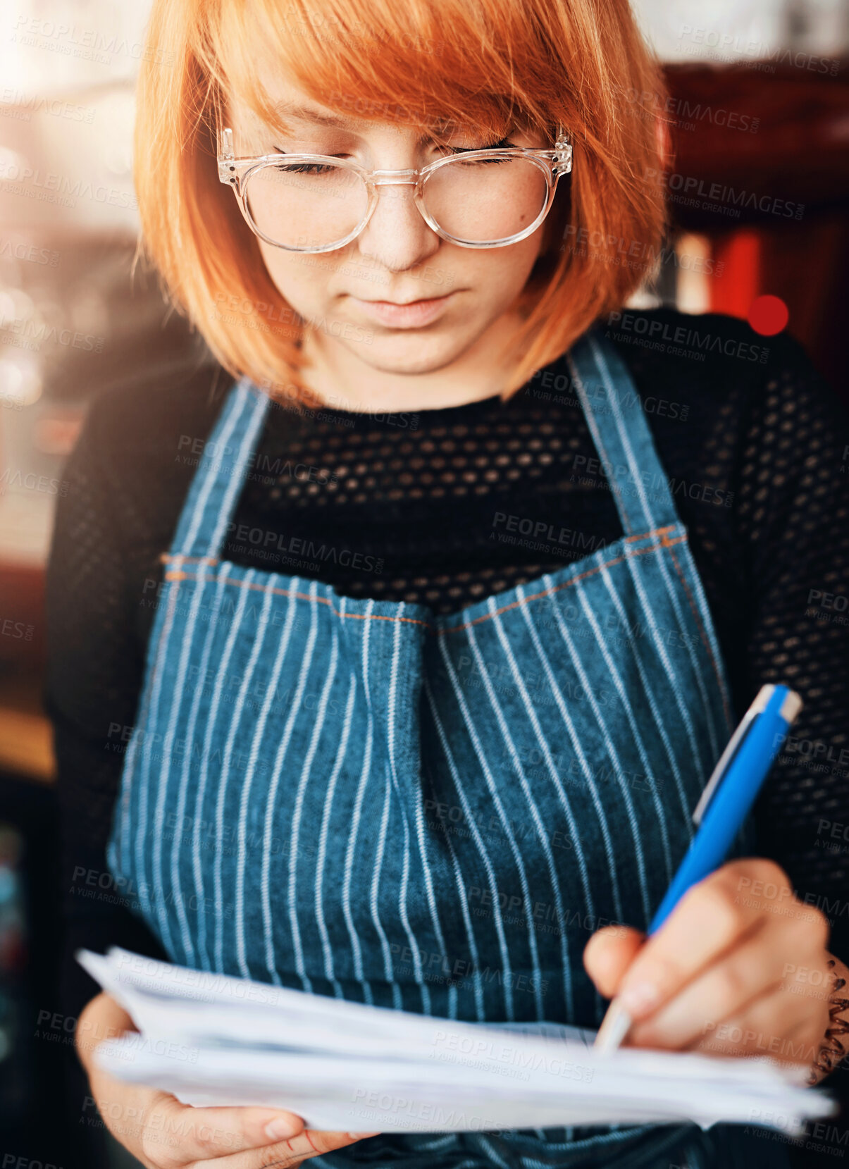 Buy stock photo Startup, woman and writing in cafe for checklist, stock control and procedure in new business. Female barista, restaurant manager and paperwork with pen for schedule, orders and inventory in deli