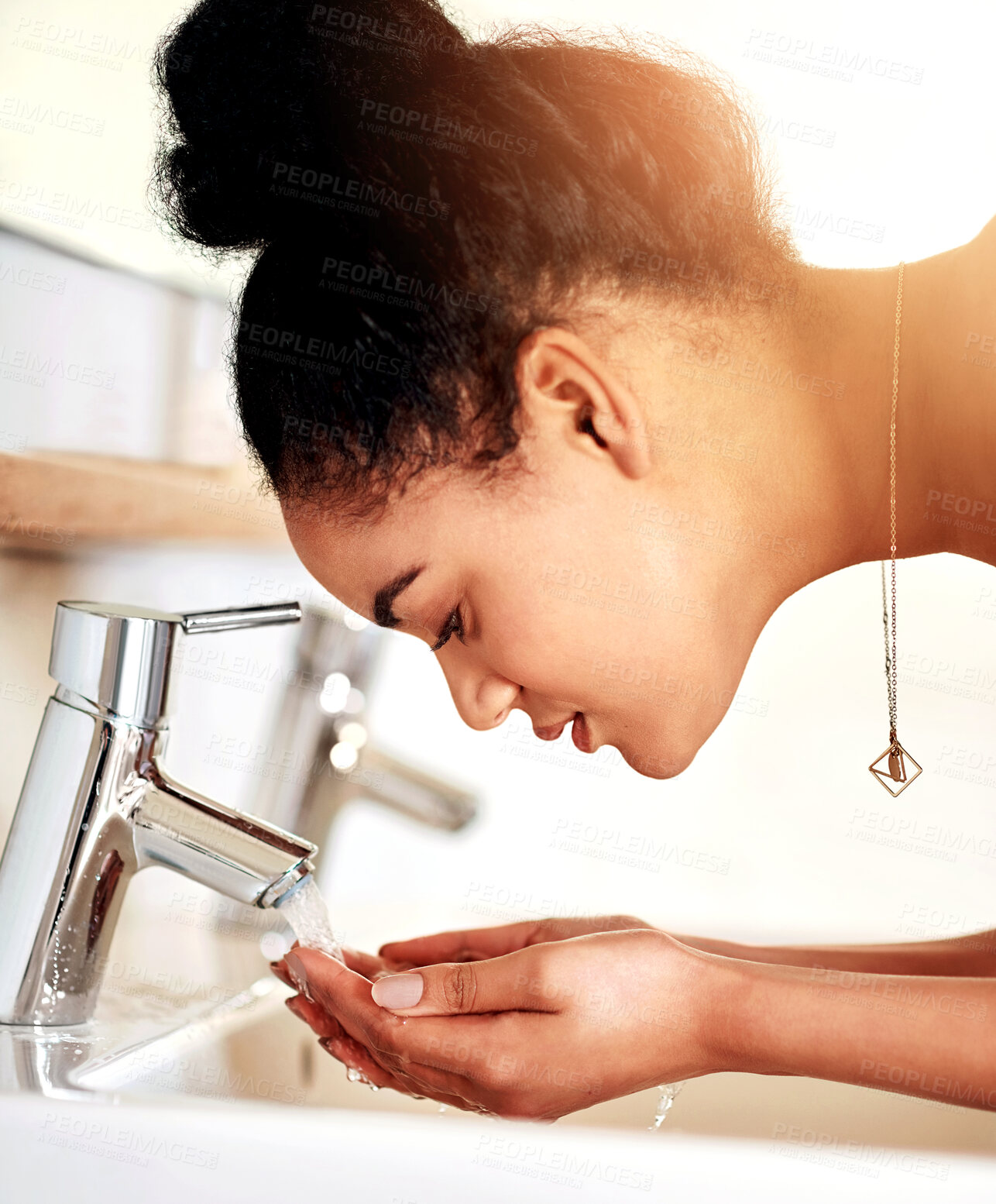 Buy stock photo Washing face, sink and woman in bathroom, skincare and water with bacteria treatment, tap and clear skin. Person, home and girl with wellness, grooming routine and dermatology with hygiene and habit