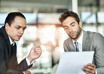 Buy stock photo Men, partner and explain in office with paper or document as contract for teamwork and collaboration. Business, employee and serious with paperwork or terms and conditions in meeting for deal