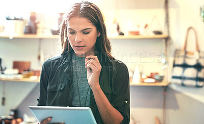 Buy stock photo Woman, store manager and online on tablet for fashion, planning and app for pricing inventory. Female person, small business owner and check shipping of stock, seller and trader website for product