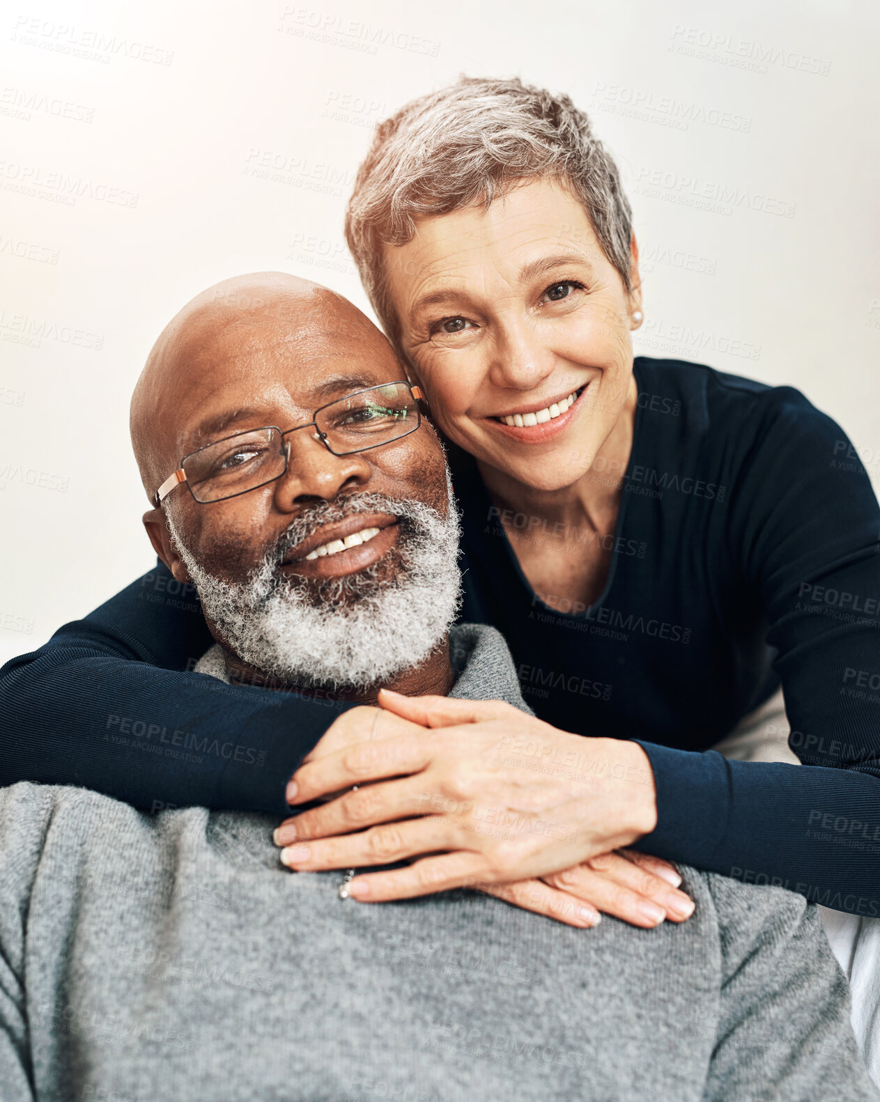 Buy stock photo Portrait, hug and senior couple with love, smile and happiness with romance, marriage and interracial. Face, mature man and woman with peace, relationship and bonding together with embrace and trust