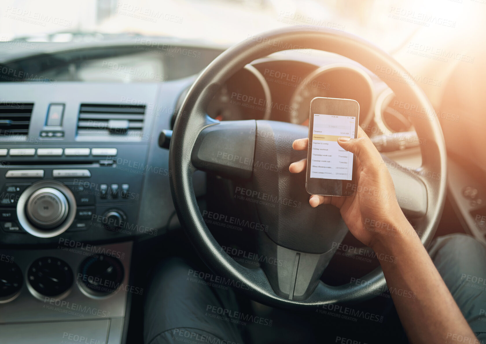 Buy stock photo Hand, smartphone and person in car, typing and transportation  with digital app, connection and travel. Ride share, driving service and driver with cellphone, lens flare and social media with screen