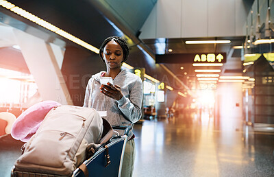 Buy stock photo Woman, airport and luggage with check on phone for travel ticket, reading notification for journey. female person, walking and suitcase in trolley for holiday, mobile app or search for hotel location