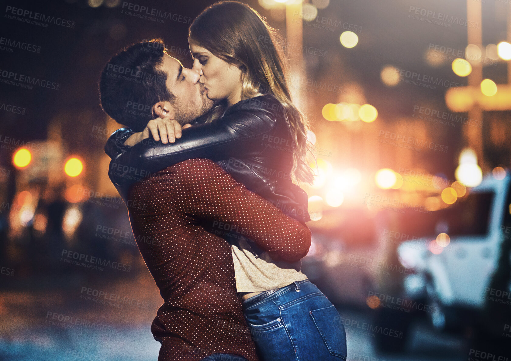 Buy stock photo Kiss, love and night with couple in city together for bonding, dating or romantic relationship. Happy, hug or street with man and woman embracing outdoor in urban town for break or evening romance