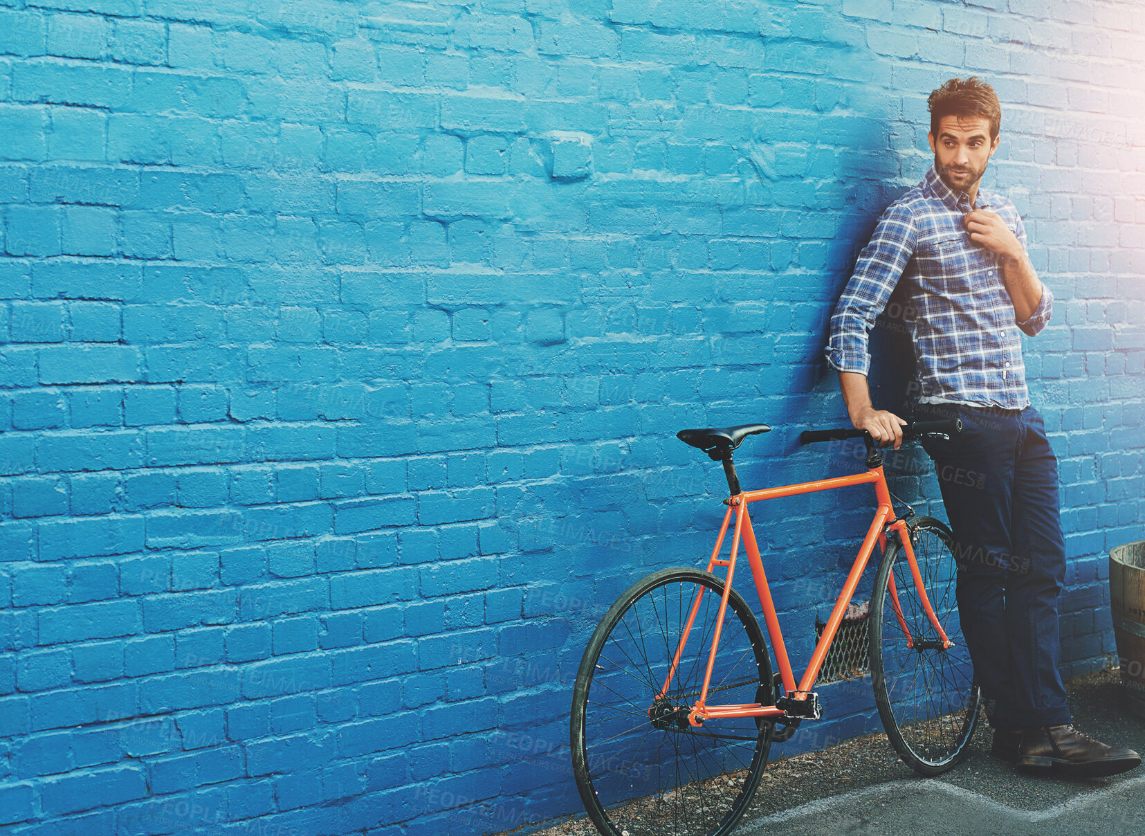 Buy stock photo Man, wall and thinking with bicycle in city for mockup space for travel, journey or direction on sidewalk. Person, bike and cycling for eco friendly commute on metro street for transport in Amsterdam
