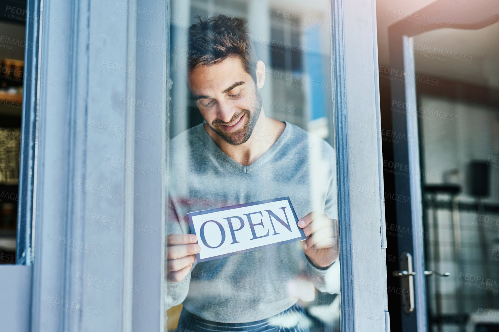 Buy stock photo Happy, waiter and man at cafe with open sign for startup or small business and ownership. Coffee shop, proud and happy or satisfied at restaurant door with welcome note for customer services