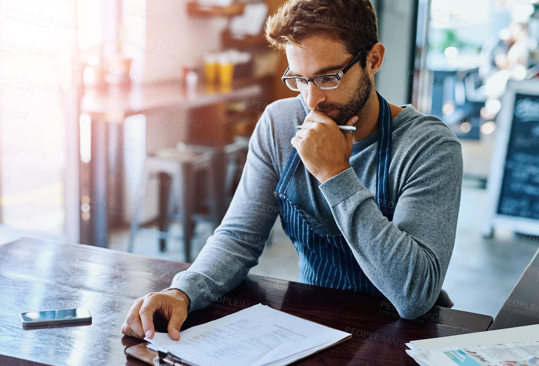 Buy stock photo Clipboard, coffee shop and thinking with owner man reading information for stock management. Documents, checklist and inventory with person working in apron at cafe for small business startup