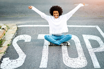 Buy stock photo Portrait, stop sign and woman with celebration, road and travel with joy, adventure or cheerful in street. African person, outdoor or girl on ground, relax or journey with reaction, smile or vacation