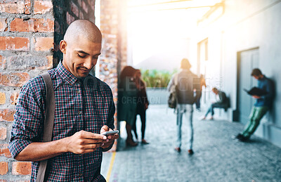 Buy stock photo Man, student and outdoor with phone, reading and typing for communication on mobile app in city. Person, smartphone and texting on metro sidewalk for commute to university with social media in Mexico