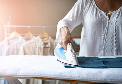 Buy stock photo Iron, clothes and laundry room with hands, home and cleaning with cleaner and electric appliance. Working, press and board for fabric steam, housekeeping and maid with homecare of woman at job