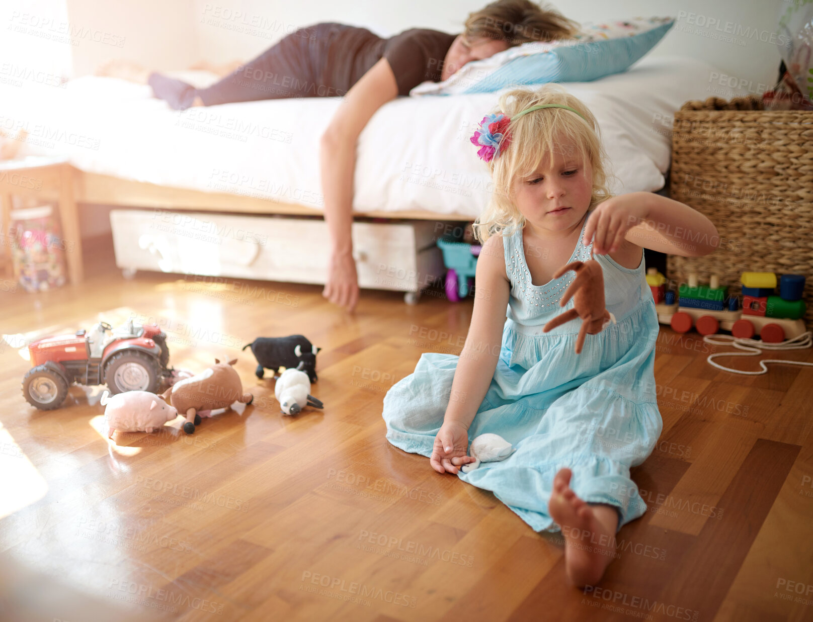 Buy stock photo Sleeping mother, child and playing in house with toys, fatigue or burnout with kid neglect. Tired mom, young daughter and parenting fail in bedroom for mental health, bored girl and mama with nap