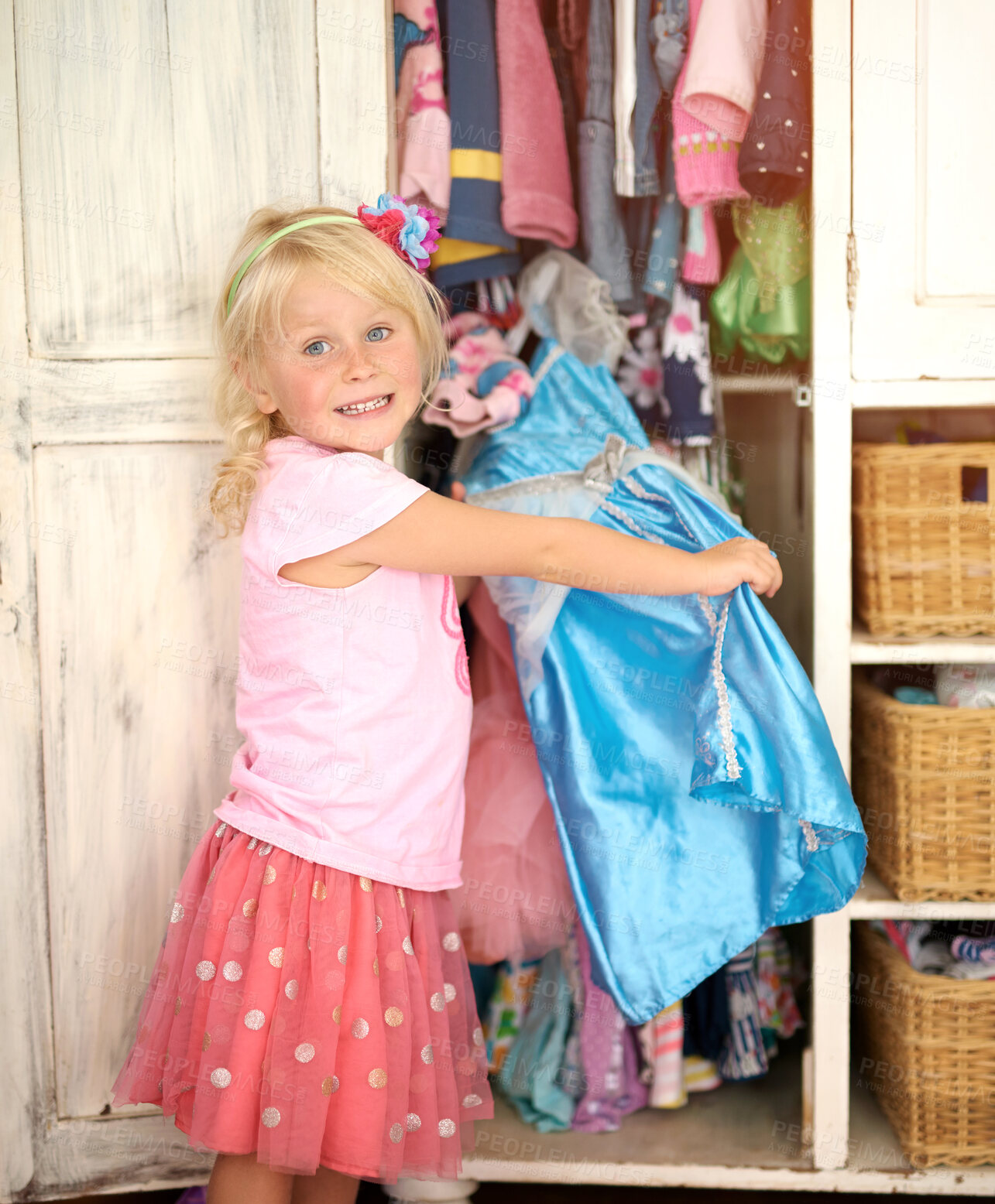 Buy stock photo Girl, portrait and dress up in bedroom for play, fantasy and choice of costume in wardrobe. Kid, excited and female child with outfit for princess character, development and halloween at home