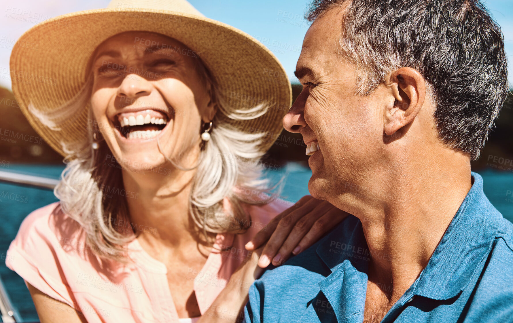 Buy stock photo Happy, couple and yacht with laughing, love and celebration or marriage anniversary with travel on water. Ocean, vacation and catamaran cruise in Portugal with smile in summer together by the sea