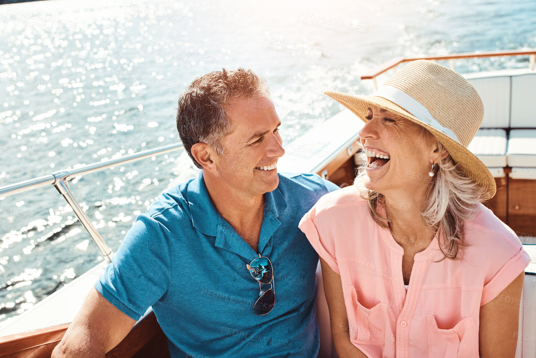 Buy stock photo Happy, couple and yacht with laugh, love and celebration or marriage anniversary with travel on water. Ocean, vacation and catamaran cruise in Portugal with smile in summer together by the sea