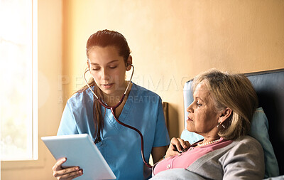 Buy stock photo Tablet, old woman and nurse with stethoscope, medical and consultation for heart condition. Caregiver, pensioner or professional with technology, healthcare or cardiology with digital app for results